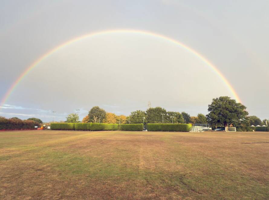 A photo of a rainbow over East Bergholt Tennis Club